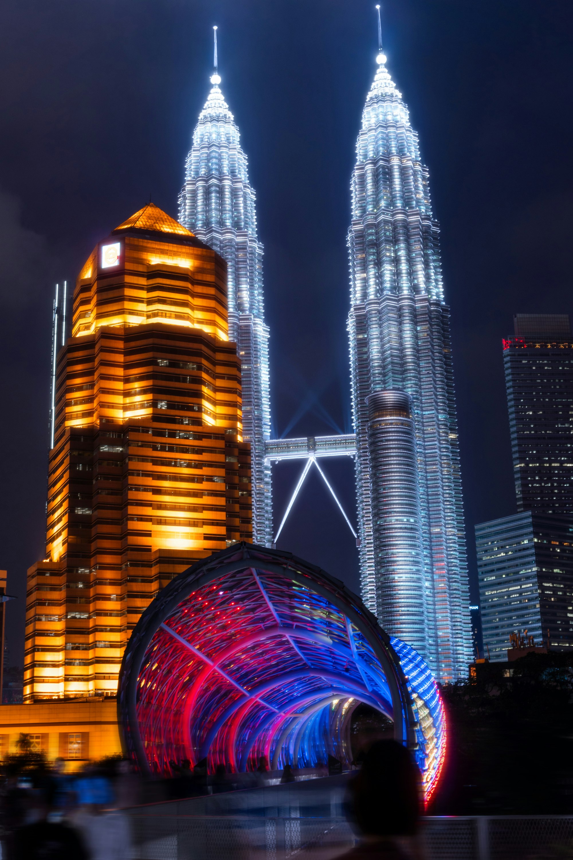 View of Petronas Twin Towers transition from day to evening showing atmospheric conditions that affect the observation deck experience